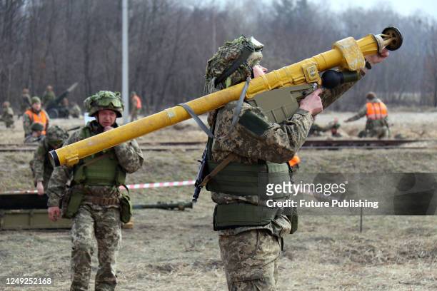 Serviceman holds a Strila-2M anti-aircraft missile system during a military exercise at a training ground, Zhytomyr Region, northern Ukraine.