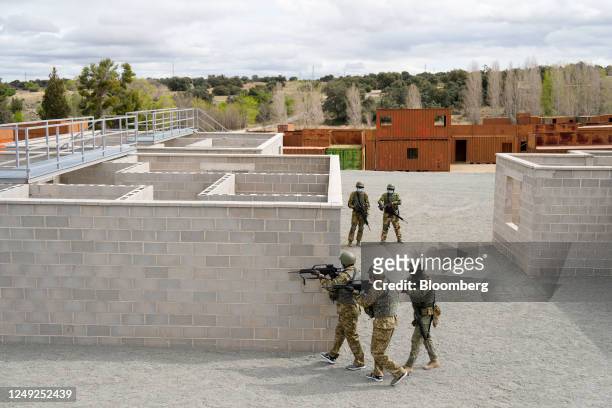 Armed Ukrainian military personnel take part in an urban warfare exercise, conducted by the Spanish military, at the Toledo infantry academy in...