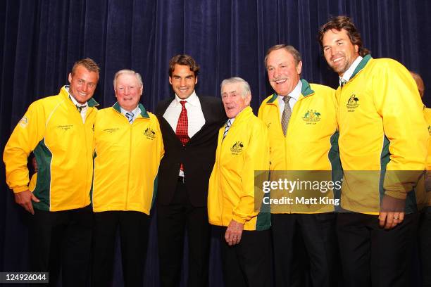 Former world number one tennis players Lleyton Hewitt, Frank Sedgman, Roger Federer, Ken Rosewall, John Newcombe and Pat Rafter appear on stage...