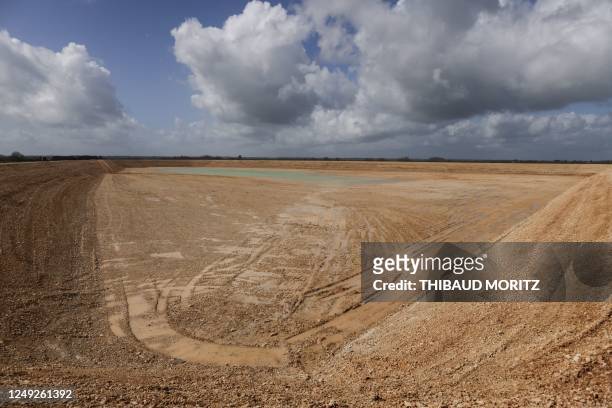 This photograph taken on 24 March 2023, shows a general view of the Sainte-Soline water reserve on the eve of a demonstration against "bassines" near...