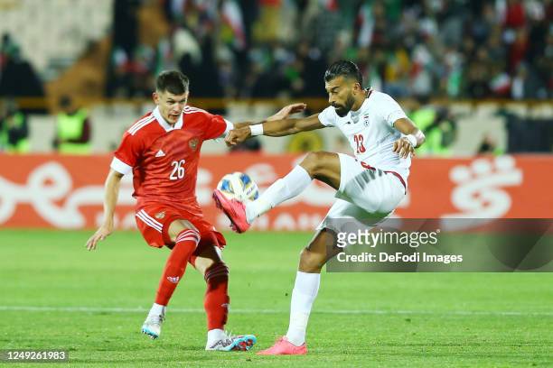 Ramin Rezaeian of Iran and Khlusevich Daniil of Russia battle for the ball during the International Friendly between Iran and Russia at Azadi Stadium...