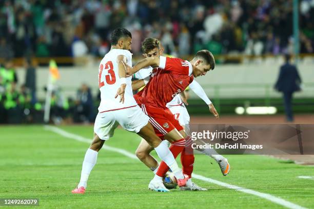 Khlusevich Daniil of Russia and Ramin Rezaeian of Iran battle for the ball during the International Friendly between Iran and Russia at Azadi Stadium...