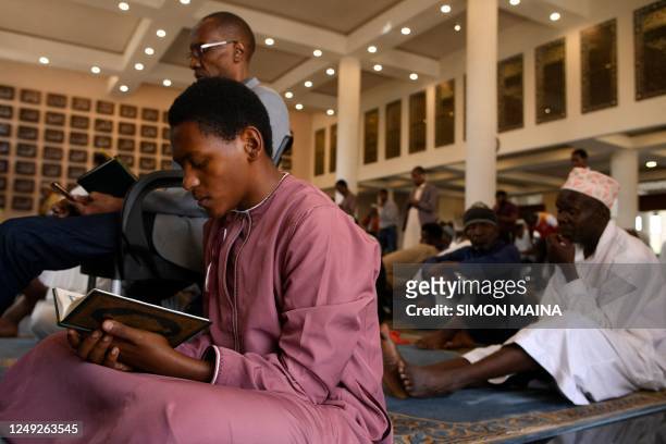 Muslim devotees offer Friday prayers at the Adams Masjid and Islamic Centre Mosque on the second day of the holy fasting month of Ramadan in Nairobi...