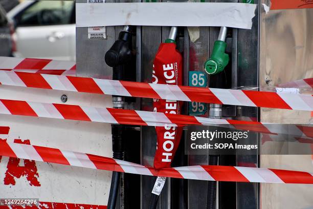 Avia gas station in Marseille shows signs that says "out of order". To protest against the pension reform, many French refineries are shut down and...