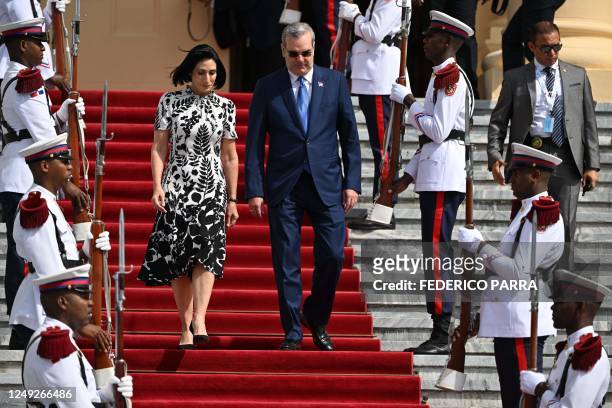 Dominican President Luis Abinader and First Lady Raquel Arbaje walk down the stairs of the National Palace to receive King Felipe VI of Spain on...