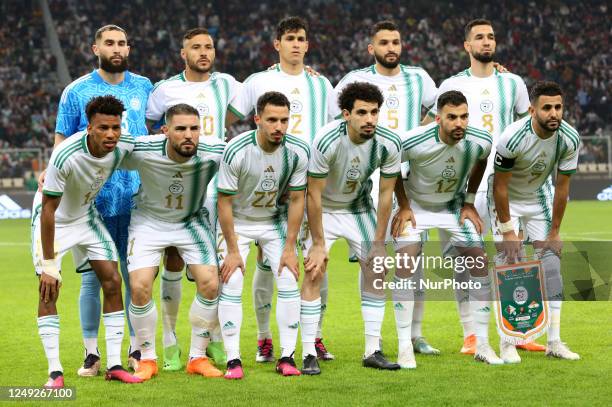 Algeria's starting players pose for group photos before the Group F match between Algeria and Niger during the 2023 Africa Cup of Nations qualifiers...