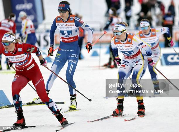 Anne Kjersti Kalvaa of Norway, Jasmin Kahara of Finland and Jonna Sundling of Sweden compete during the women's Cross-Country free style Team Sprint...