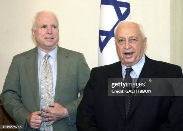 Israeli Prime Minister Ariel Sharon greets US Senator John McCain, R-AZ, 17 August 2003 prior to a meeting at Sharon' Jerusalem office. Top US...