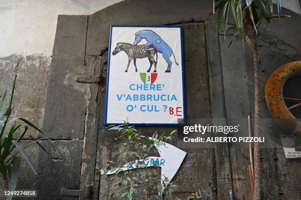 Drawing showing Napoli's mascot, a donkey, mocking Juventus' mascot, a zebra, is displayed at Via Dei Tribunali on March 24, 2023 in Naples, as the...