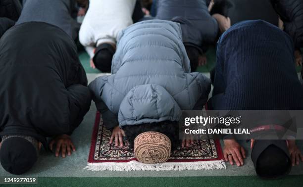 Members of the Ahmadiyya Muslim Community attend Friday prayers at the Baitul Futuh Mosque in Morden, south west London on March 24 on the second day...