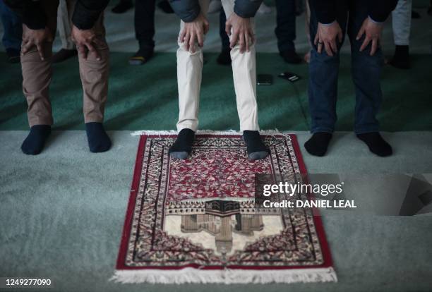 Members of the Ahmadiyya Muslim Community attend Friday prayers at the Baitul Futuh Mosque in Morden, south west London on March 24 on the second day...