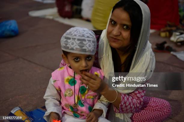 Muslims people break their fast on the first day of Ramadan Roza iftar in front of Illuminated Jama Masjid of Eid-ul-Fitr festival, on March 24, 2023...