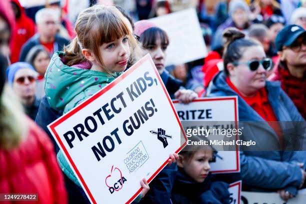 Child holds a sign during a protest to end gun violence in schools at the Colorado State Capitol on March 24, 2023 in Denver, Colorado. The protest...