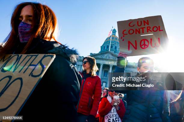 People march around the Colorado State Capitol during a protest to end gun violence in schools on March 24, 2023 in Denver, Colorado. The protest...