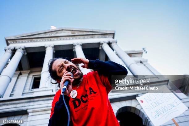 Demonstrator with the Denver Classroom Teachers Association leads a chant at a protest to end gun violence in schools at the Colorado State Capitol...