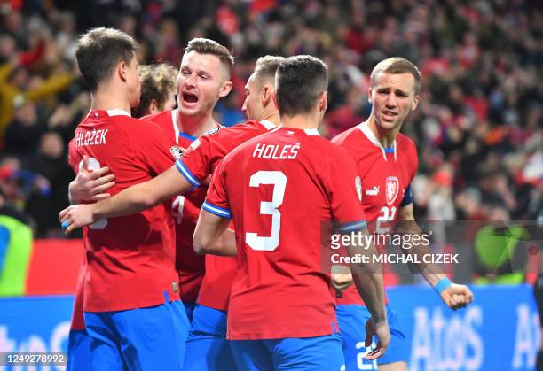 Czech Republic's players celebrate after scoring during the UEFA Euro 2024 Group E qualification match between Czech Republic and Poland at the...