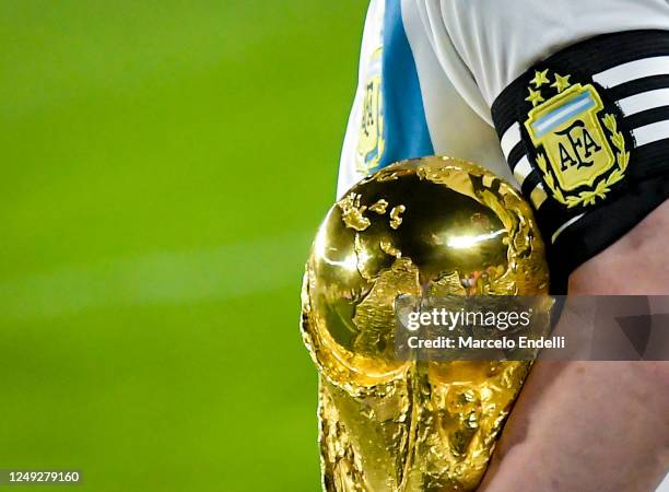 Lionel Messi of Argentina holds the FIFA World Cup trophy during World Champions' celebrations after an international friendly between Argentina and...