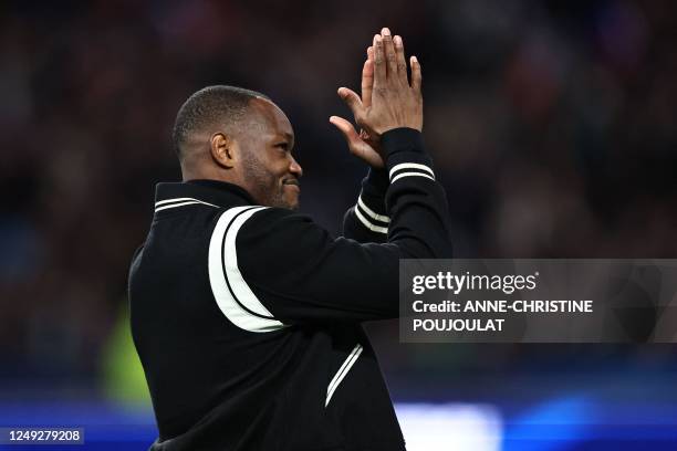 France's former goalkeeper Steve Mandanda gestures during a ceremony to mark the retirement from international career with France prior to the UEFA...