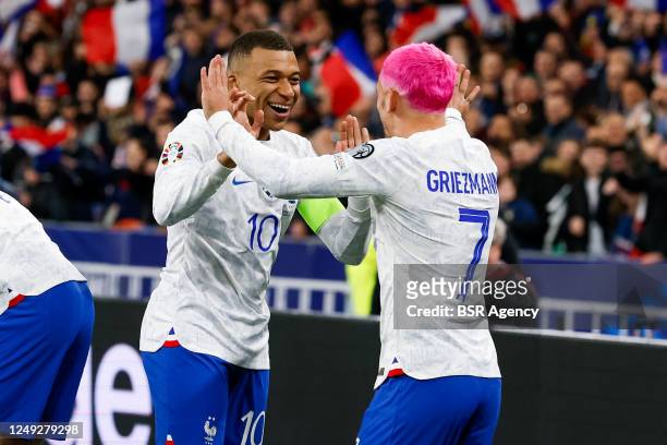 Kylian Mbappe of France and Antoine Griezmann of France celebrate their sides first goal during the UEFA EURO 2024 Qualifying Round Group B match...