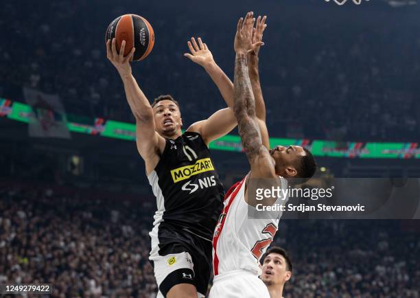 Dante Exum of Partizan in action againstJoel Bolomboy of Olympiacos during the 2022-23 Turkish Airlines EuroLeague Regular Season Round 30 game...
