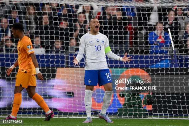 France's forward Kylian Mbappe celebrates after scoring his team's third goal during the UEFA Euro 2024 qualification football match between France...