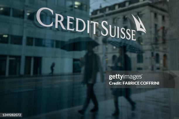 This photograph taken on March 24, 2023 in Geneva, shows a sign of Credit Suisse bank. - The marriage of UBS and Credit Suisse was hastily arranged...