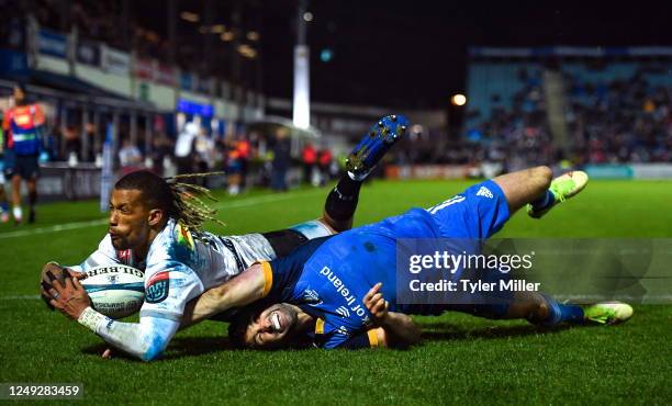 Dublin , Ireland - 24 March 2023; Clayton Bloometjies of DHL Stormers dives over to score his side's third try despite the efforts of Dave Kearney of...