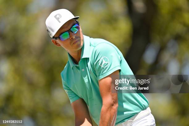 Rickie Fowler looks over his ball on the first tee box during the third day of the World Golf Championships-Dell Technologies Match Play at Austin...