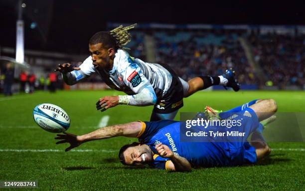 Dublin , Ireland - 24 March 2023; Clayton Bloometjies of DHL Stormers dives over to score his side's third try despite the efforts of Dave Kearney of...