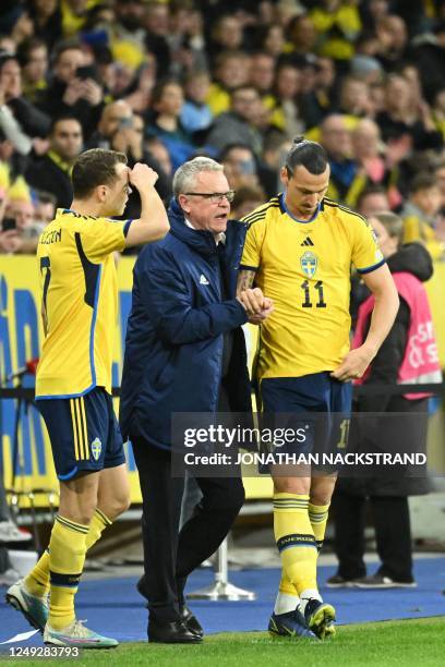 Sweden's forward Zlatan Ibrahimovic receives instructions from Sweden's coach Janne Andersson before coming on during the UEFA Euro 2024 group F...