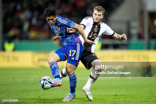 Yudai Kimura of Japan and Louis Jordan Beyer of Germany battle for the ball during the International Friendly match between Germany U21 and Japan U21...