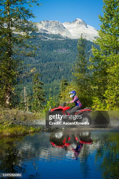 atv adventure during a mountain holiday - atv riding stock pictures, royalty-free photos & images