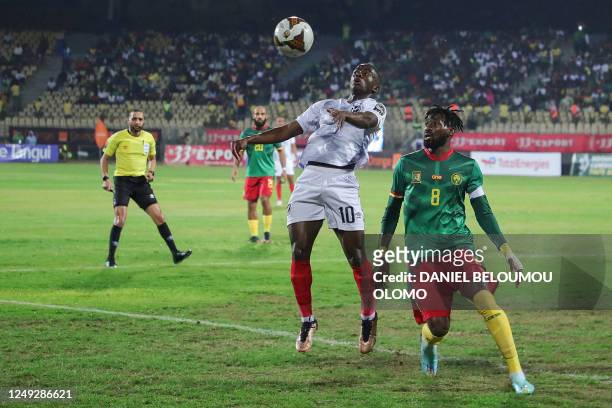 Namibia's Prins Tjiueza and Cameroon's Andre-Frank Zambo Anguissa eye the ball during the 2023 Africa Cup of Nations Group C qualifier match between...
