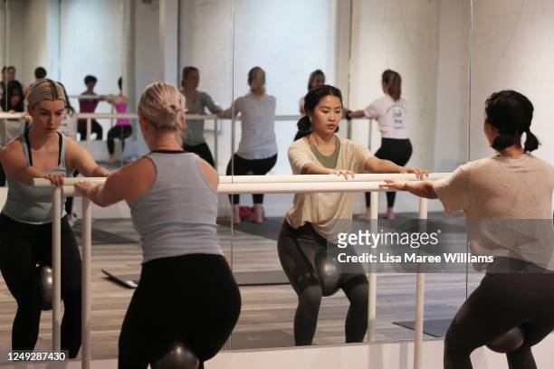Clients participate in a barre class taken by Lucy Beaumont the owner and instructor at Scout Pilates in St Peters on June 13, 2020 in Sydney,...