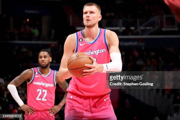 Kristaps Porzingis of the Washington Wizards prepares to shoot a free throw against the San Antonio Spurs on March 24, 2023 at Capital One Arena in...