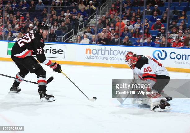 Tage Thompson of the Buffalo Sabres scores his 100th career NHL goal against Akira Schmid of the New Jersey Devils during a game on March 24, 2023 at...