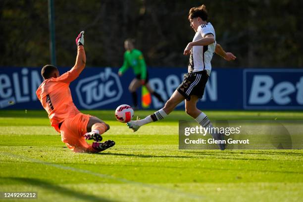 Lovis Bierschenk tries to lob Guillaume Restes during the international friendly match between France U18 and Germany U18 at Centre National du...