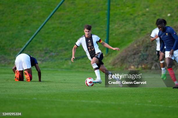 Tom Bischof manges to secure the possession during the international friendly match between France U18 and Germany U18 at Centre National du Football...