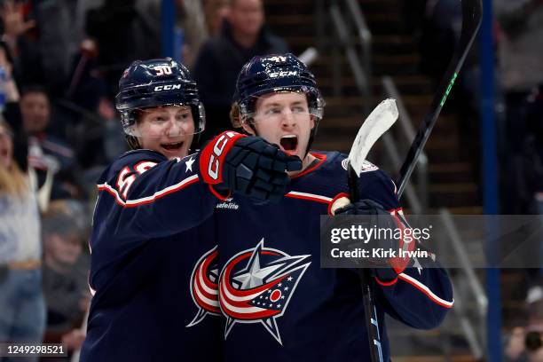 Eric Robinson of the Columbus Blue Jackets celebrates with Hunter McKown after scoring a goal during the second period of the game against the New...