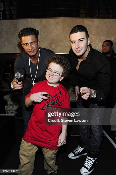 Pauly D, YouTube superstar Keenan Cahill and television personality Vinny Guadagnino posse after a birthday performance at Nove Italiano inside The...