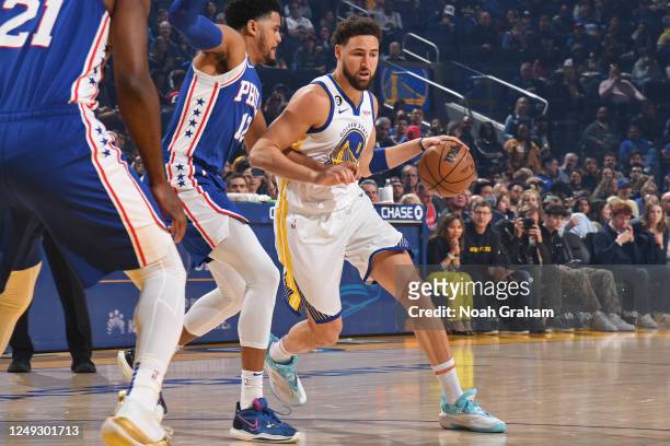 Klay Thompson of the Golden State Warriors dribbles the ball during the game against the Philadelphia 76ers on March 24, 2023 at Chase Center in San...