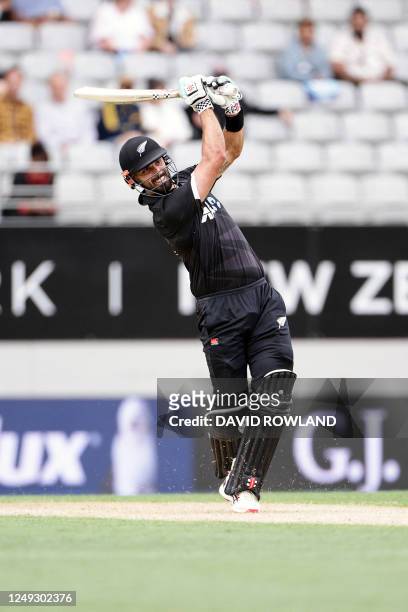 New Zealand's Daryl Mitchell strikes 6 runs during the first one-day international cricket match between New Zealand and Sri Lanka at Eden Park in...