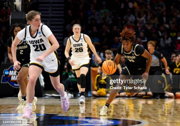 Colorado Buffaloes guard Jaylyn Sherrod brings the ball up the court on Iowa Hawkeyes guard Kate Martin during the Sweet Sixteen round of the 2023...