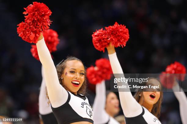 The Louisville Cardinals cheerleaders perform against the Ole Miss Rebels during the Sweet Sixteen round of the 2023 NCAA Womens Basketball...
