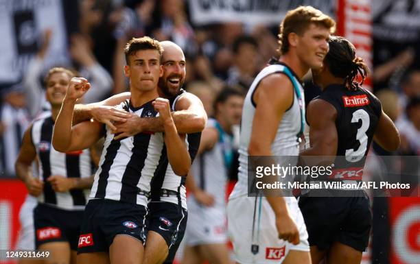Nick Daicos and Steele Sidebottom of the Magpies celebrate during the 2023 AFL Round 02 match between the Collingwood Magpies and the Port Adelaide...