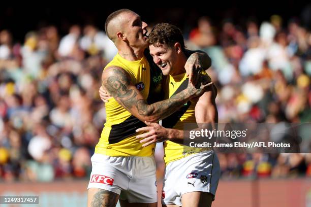 Jacob Hopper and Dustin Martin of the Tigers celebrate a goal during the 2023 AFL Round 02 match between the Adelaide Crows and the Richmond Tigers...