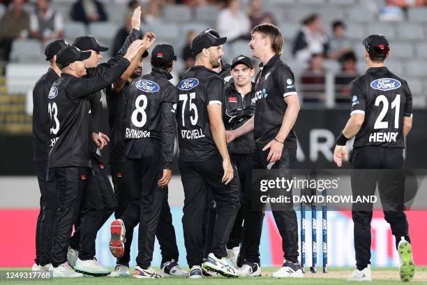 New Zealand's Blair Tickner celebrates with teammates after taking the wicket of Sri Lanka's Angelo Mathews during the first one-day international...