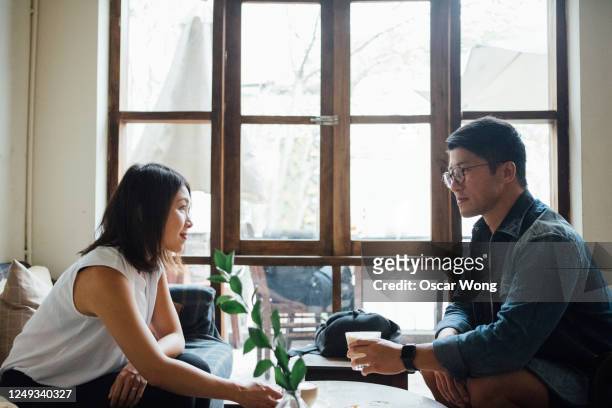 beautiful young couple dating at cafe - dating stock pictures, royalty-free photos & images