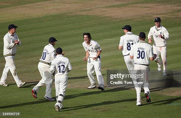 Chris Wright of Warwickshire celebrates taking the wicket of James Tomlinson of Hampshire during the LV County Championship match between Hampshire...