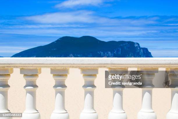 white banister against the beach - beach balcony stock pictures, royalty-free photos & images